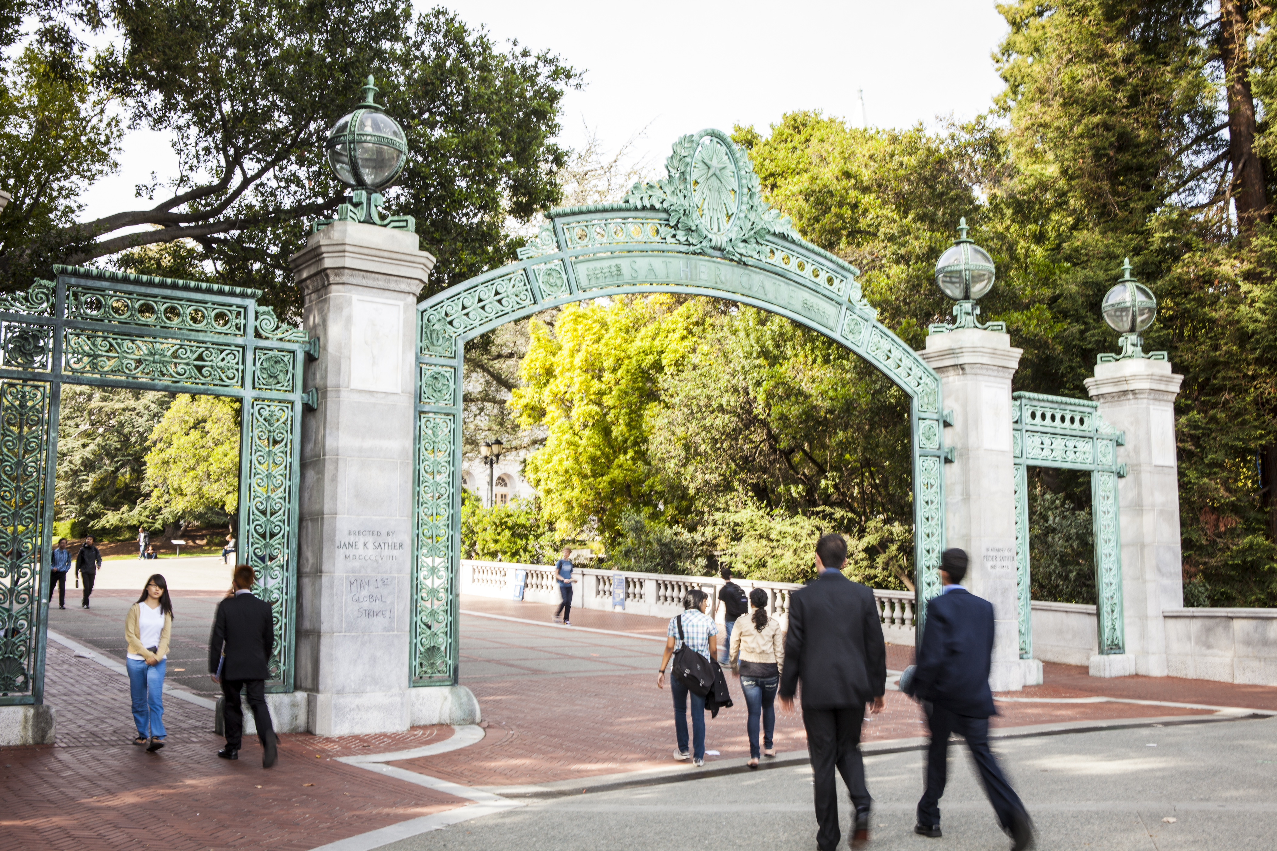 People in front of a green gate