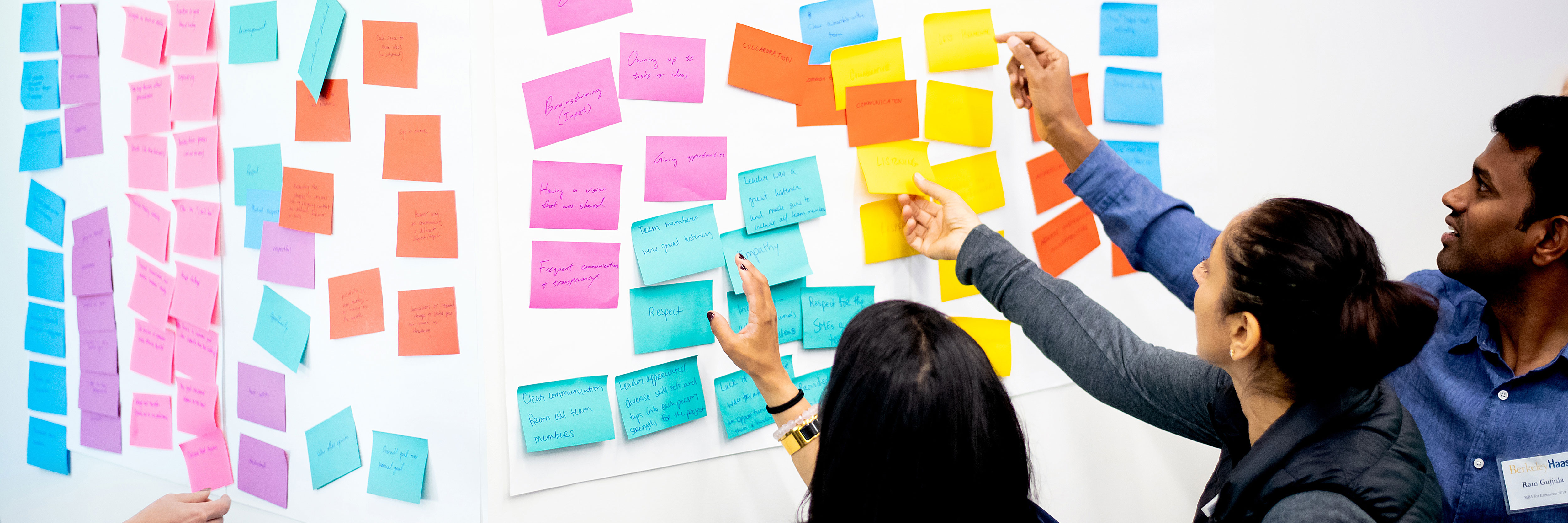 A group of students work on a whiteboard