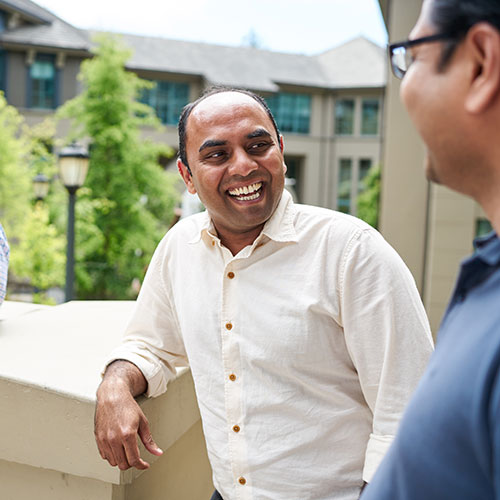 Two students laughing