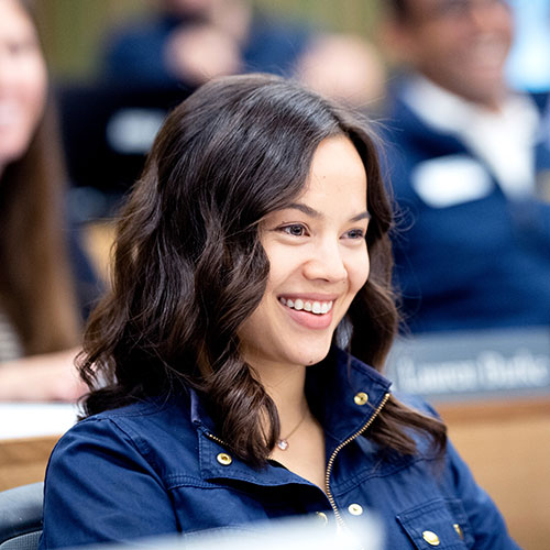 A female student smiling in class