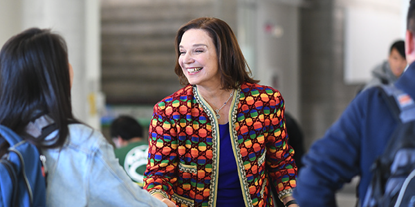 Dean Ann Harrison talks with a student.